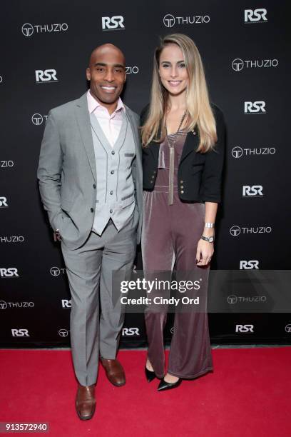 Tiki Barber and Traci Lynn Johnson arrive at the Thuzio & Rosenhaus Party during Super Bowl weekend at The Exchange & Alibi Lounge on February 2,...