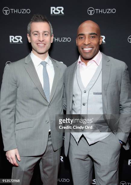 Jared Augustine and Tiki Barber arrive at the Thuzio & Rosenhaus Party during Super Bowl weekend at The Exchange & Alibi Lounge on February 2, 2018...