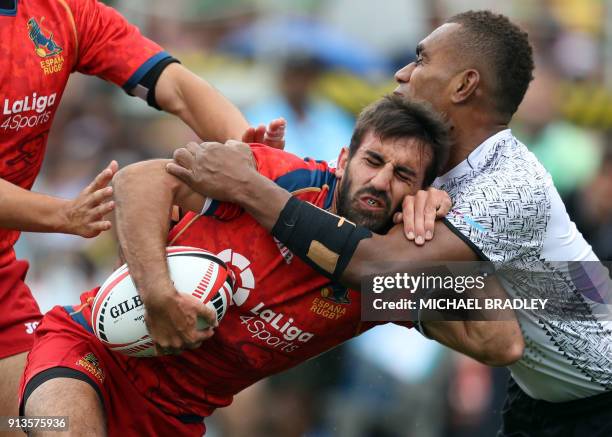 Spain's Pol Pla is tackled by Fiji's Eroni Sau in action during the World Rugby Sevens Series match between Fiji and Spain at Waikato Stadium in...