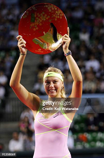 Maria Sharapova of Russia poses with the trophy after winning the women's final match against Jelena Jankovic of Serbia during day seven of the Toray...