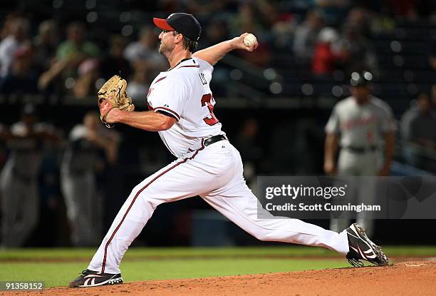 Derek Lowe of the Atlanta Braves pitches against the Washington Nationals at Turner Field on October 2, 2009 in Atlanta, Georgia.