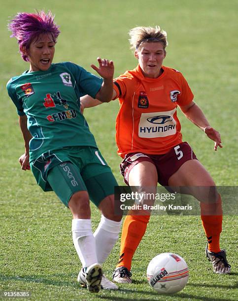 Shu O Tseng of United and Brooke Spence of the Roar compete for the ball during the round one W-League match between the Brisbane Roar and Canberra...