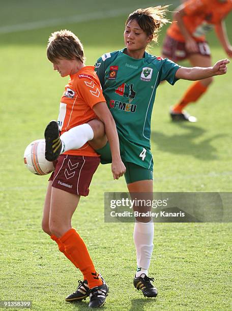 Chiung Ying Lin of United tackles Courtney Beutel of the Roar during the round one W-League match between the Brisbane Roar and Canberra United at...