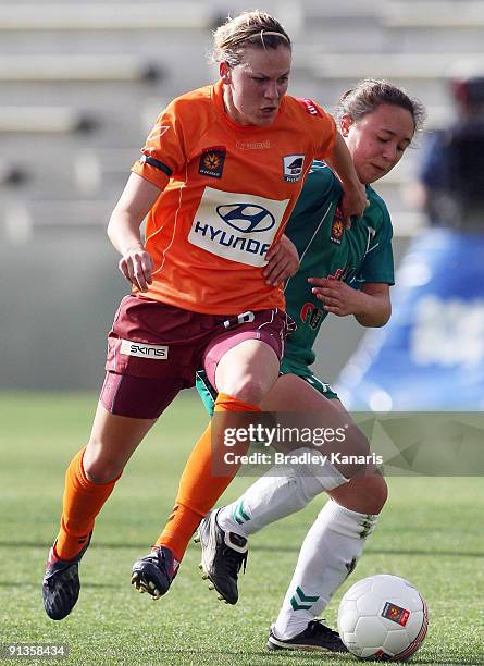 Lauren Colthorpe of the Roar takes Jennifer Bisset of United during the round one W-League match between the Brisbane Roar and Canberra United at...