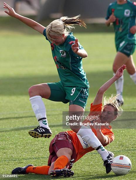 Grace Gill of United is tackled by Lauren Colthorpe of the Roar during the round one W-League match between the Brisbane Roar and Canberra United at...