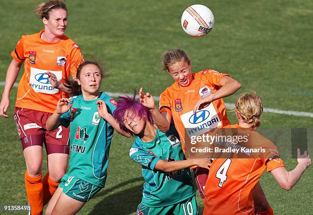 Aivi Luik of the Roar and Shu O Tseng of United collide as they jumps for a header during the round one W-League match between the Brisbane Roar and...