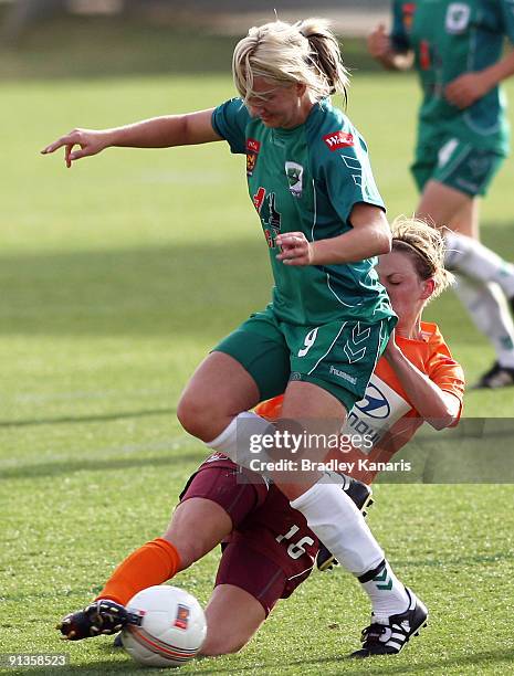 Grace Gill of United is tackled by Lauren Colthorpe of the Roar during the round one W-League match between the Brisbane Roar and Canberra United at...