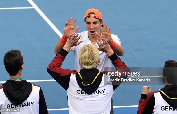 Jan-Lennard Struff of Germany celebrates with Boris Becker after winning the doubles match against Matt Ebden and John Peers of Australia during the...