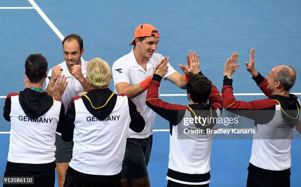 Jan-Lennard Struff and Tim Putz of Germany celebrate with team mates after winning the doubles match against Matt Ebden and John Peers of Australia...