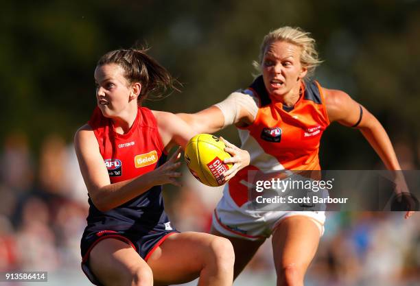 Jasmine Grierson of the Demons is tackled by Phoebe McWilliams of the Giants during the round one AFLW match between the Melbourne Demons and the...
