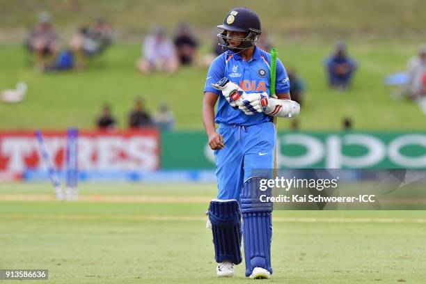 Prithvi Shaw of India looks dejected after being dismissed by Will Sutherland of Australia during the ICC U19 Cricket World Cup Final match between...