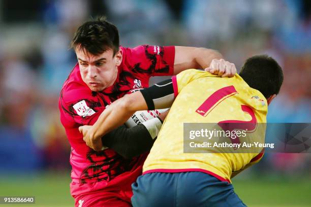 Joe Jenkins of Wales on the charge against Alejandro Alonso of Spain during the 2018 New Zealand Sevens at FMG Stadium on February 3, 2018 in...