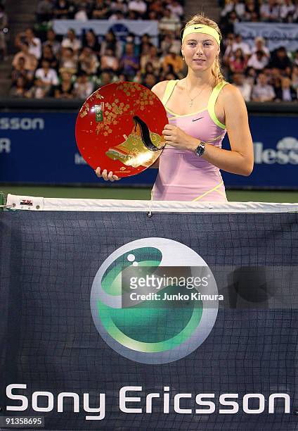 Maria Sharapova of Russia poses with the trophy after winning the women's final match against Jelena Jankovic of Serbia during day seven of the Toray...