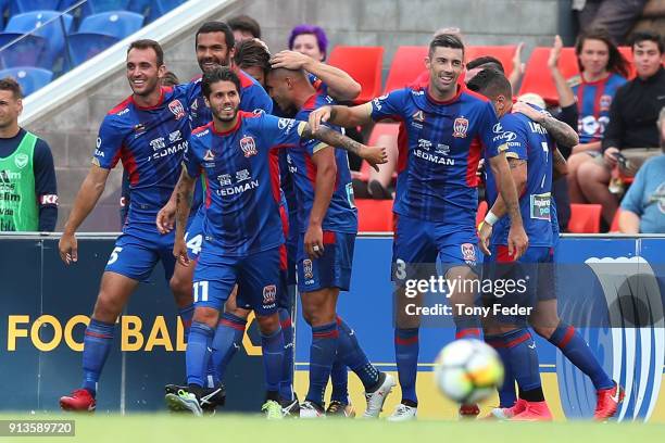 Jets players celebrate a goal during the round 19 A-League match between the Newcastle Jets and the Melbourne Victory at McDonald Jones Stadium on...