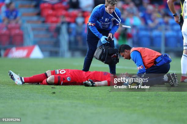 Victory goalkeeper Lawrence Thomas is injured during the round 19 A-League match between the Newcastle Jets and the Melbourne Victory at McDonald...