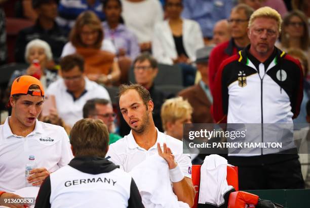 German tennis great Boris Becker looks on as Tim Puetz and Jan-Lennard Struff of Germany receive instructions from Germany's captain Michael Kohlmann...