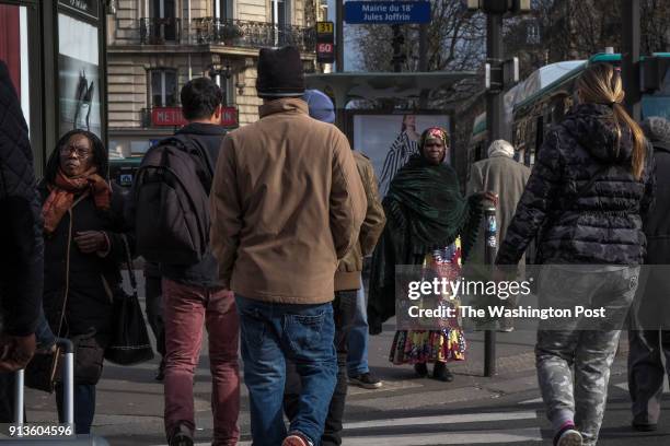 Mix of people pass through the streets near the Jules Joffrin metro station in the north part of the city on March 7 in Paris, France. France, whose...