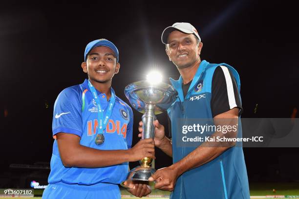 Captain Prithvi Shaw of India and Head Coach Rahul Dravid of India pose with the trophy after their win in the ICC U19 Cricket World Cup Final match...