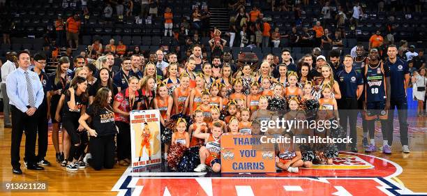 Seen is a group photo of the Taipans players, support staff, cheerleaders and dancers at the end of the round 17 NBL match between the Cairns Taipans...