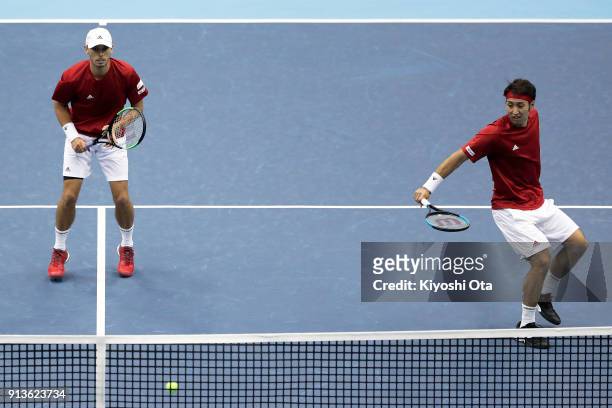 Ben McLachlan and Yasutaka Uchiyama of Japan play in their doubles match against Simone Bolelli and Fabio Fognini of Italy during day two of the...
