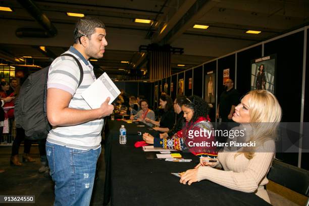 Actress Pamela Anderson signs autographs as she attends the '25th Paris Manga & Sci-Fi Show' at Parc des Expositions Porte de Versailles on February...