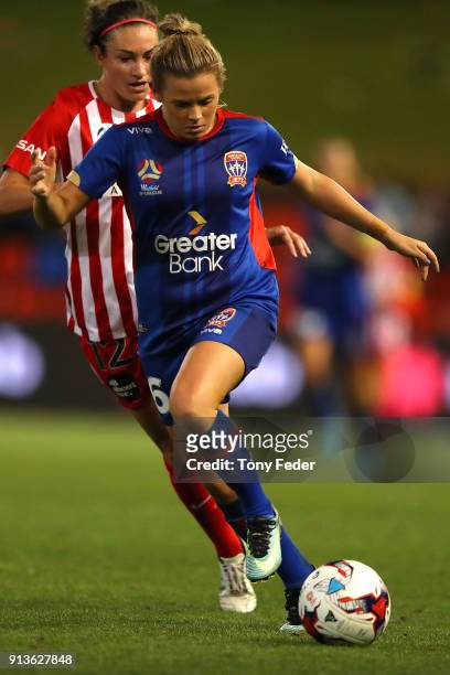 Cassidy Davis of the Jets contests the ball with Jodie Taylor of City during the round 14 W-League match between the Newcastle Jets and Melbourne...