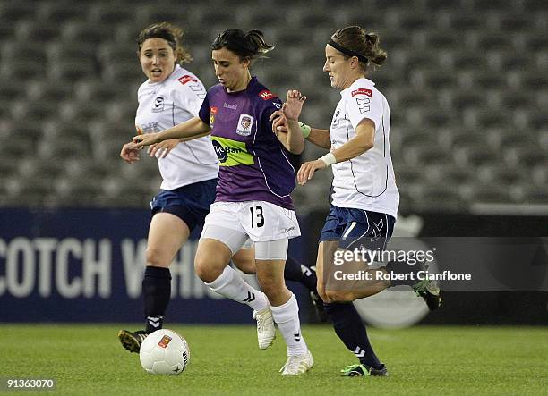 Elisa D'ovidio of the Glory is pressured during the round one W-League match between the Melbourne Victory and Perth Glory at Etihad Stadium on...