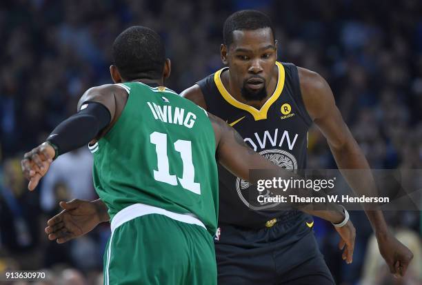 Kyrie Irving of the Boston Celtics and Kevin Durant of the Golden State Warriors greet each other prior to the start of their NBA basketball game at...
