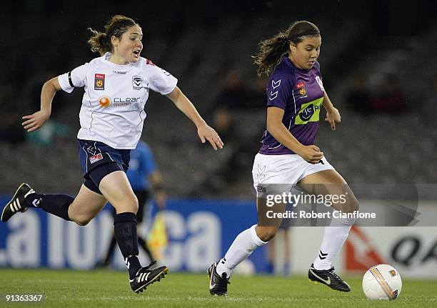 Samantha Kerr of the Glory is chased by Tal Karp of the Victory during the round one W-League match between the Melbourne Victory and Perth Glory at...