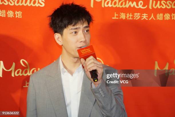 Actor Jing Boran attends the unveiling ceremony of his wax figure at Madame Tussauds on February 3, 2018 in Shanghai, China.