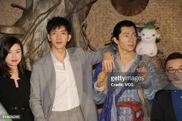 Actor Jing Boran poses with his wax figure during the unveiling ceremony at Madame Tussauds on February 3, 2018 in Shanghai, China.