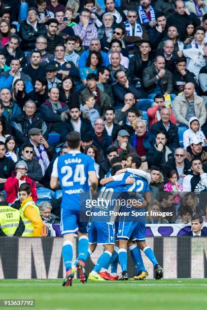 Players of RC Deportivo La Coruna celebrates teammate Adrian Lopez Alvarez's goal during the La Liga 2017-18 match between Real Madrid and RC...