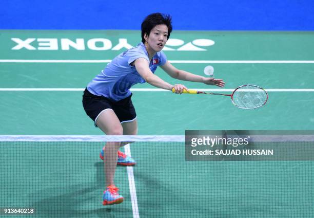 Hong Kong badminton player Cheung Ngan Yi plays a return against United States badminton player Beiwen Zhang during their women's singles semi-final...