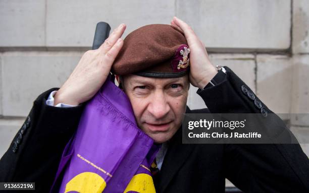 Party leader Henry Bolton adjust his beret from the The Royal Hussars, of which he was Lance Corporal, during a Justice for Veterans protest at...