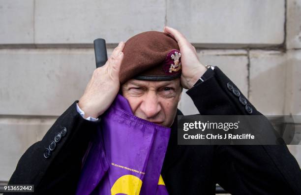 Party leader Henry Bolton adjust his beret from the The Royal Hussars, of which he was Lance Corporal, during a Justice for Veterans protest at...