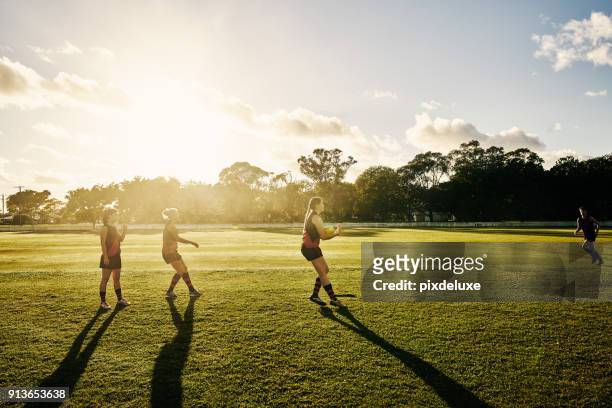 champions play as one - afl woman stock pictures, royalty-free photos & images