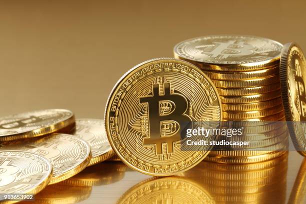 golden bitcoins. new virtual money - bitcoin stock pictures, royalty-free photos & images
