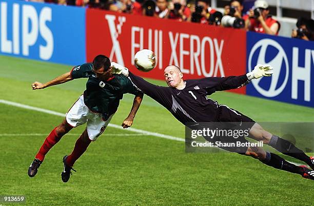 Goalkeeper Brad Friedel of the USA makes a save from Jared Borgetti of Mexico during the Mexico v USA, World Cup Second Round match played at the...