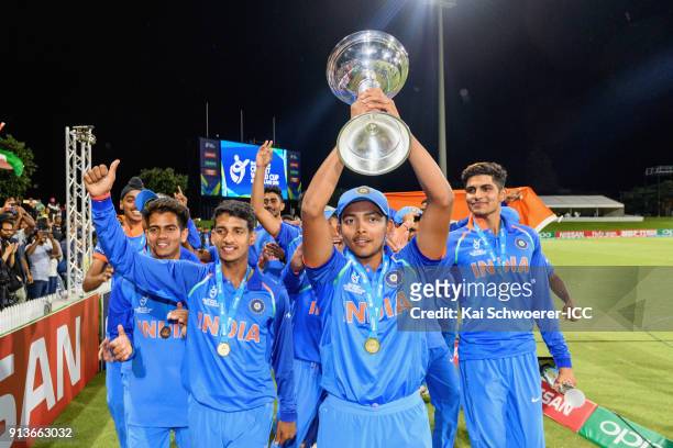Captain Prithvi Shaw of India lifts the trophy after the win in the ICC U19 Cricket World Cup Final match between Australia and India at Bay Oval on...