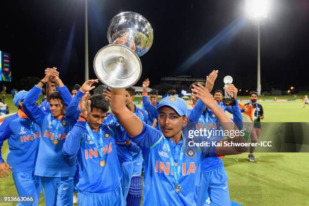 Captain Prithvi Shaw of India lifts the trophy after the win in the ICC U19 Cricket World Cup Final match between Australia and India at Bay Oval on...