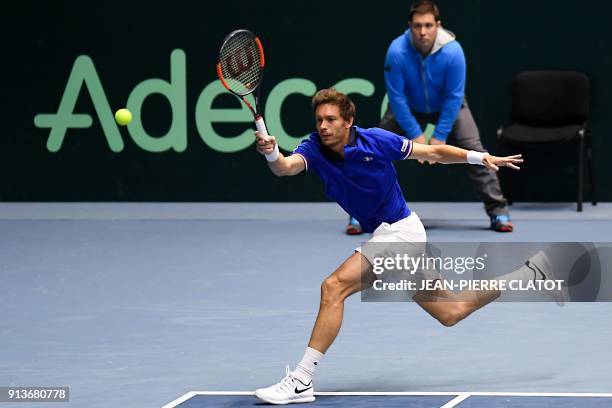 France's Nicolas Mahut hits a return against Netherlands' double Jean-Julien Rojer and Robin Haase during the Davis Cup World Group first round...