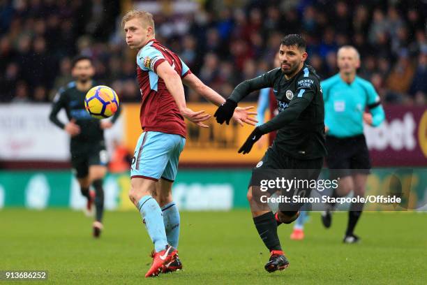 Ben Mee of Burnley battles with Sergio Aguero of Man City during the Premier League match between Burnley and Manchester City at Turf Moor on...