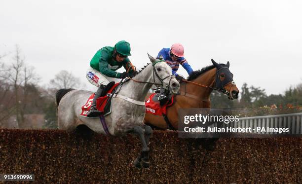 Terrefort and Daryl Jacob clear the last fence in company with Cyrname and Sean Bowen before going on to win The Betfred TV Scilly Isles Novices...