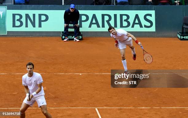 Canada's Daniel Nestor and Vasek Pospis return the ball to Croatia's Marin Cilic and Ivan Dodig during the first round Davis Cup World Group doubles...