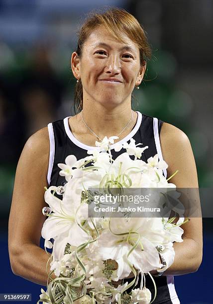 Ai Sugiyama of Japan smiles during a ceremony on day seven of the Toray Pan Pacific Open Tennis tournament at Ariake Colosseum on October 3, 2009 in...