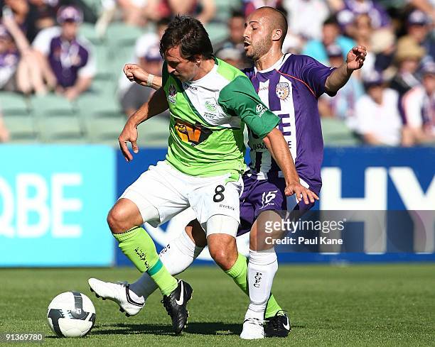 Adriano Pellegrino of the Glory and Shane Stefanutto of the Fury compete for the ball during the round nine A-League match between the Perth Glory...