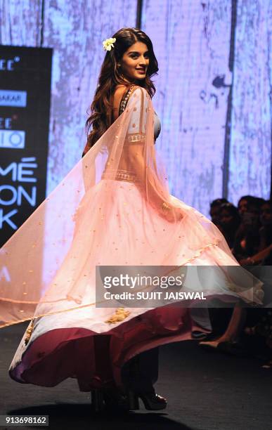 Indian Bollywood actress Nidhhi Agerwal showcases a creation by designer Suloka Sudhakar at the Lakmé Fashion Week Summer Resort 2018 in Mumbai on...