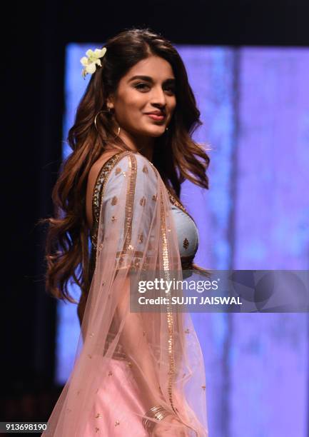 Indian Bollywood actress Nidhhi Agerwal showcases a creation by designer Suloka Sudhakar at the Lakmé Fashion Week Summer Resort 2018 in Mumbai on...