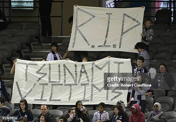 Fans remember the victims of the Pacific Islands tsunami during the round one W-League match between the Melbourne Victory and Perth Glory at Etihad...