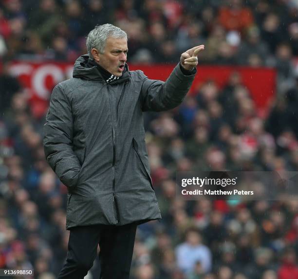 Manager Jose Mourinho of Manchester United watches from the touchline during the Premier League match between Manchester United and Huddersfield Town...